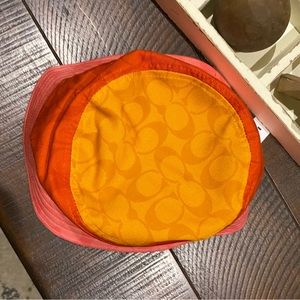 Coach  signature blocked bucket hat.